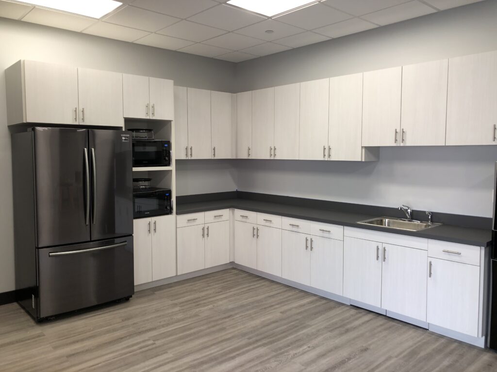Break Room Kitchen with white cabinets
